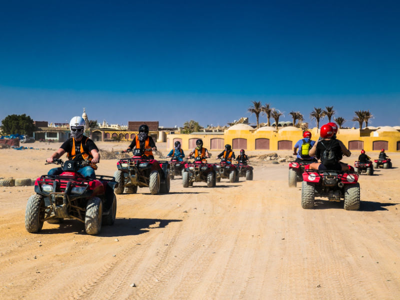 A group of people on atv quad bikes