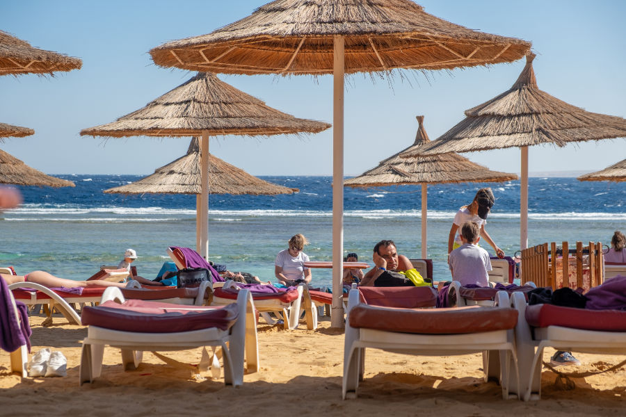 Guests soaking up the sun on the beach